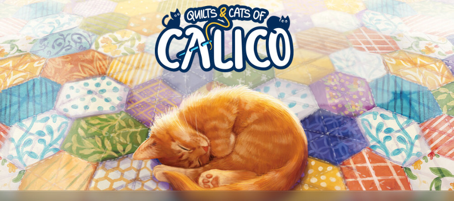 A sleeping orange cat on a quilt in front of the logo for Quilts and Cats of Calico.