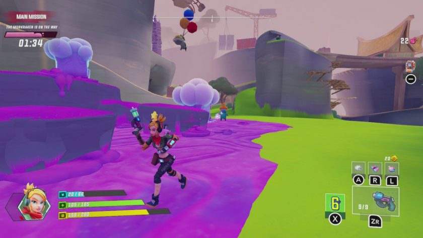 April walking through a level, she is being followed by a small blue alien and one hanging from balloons