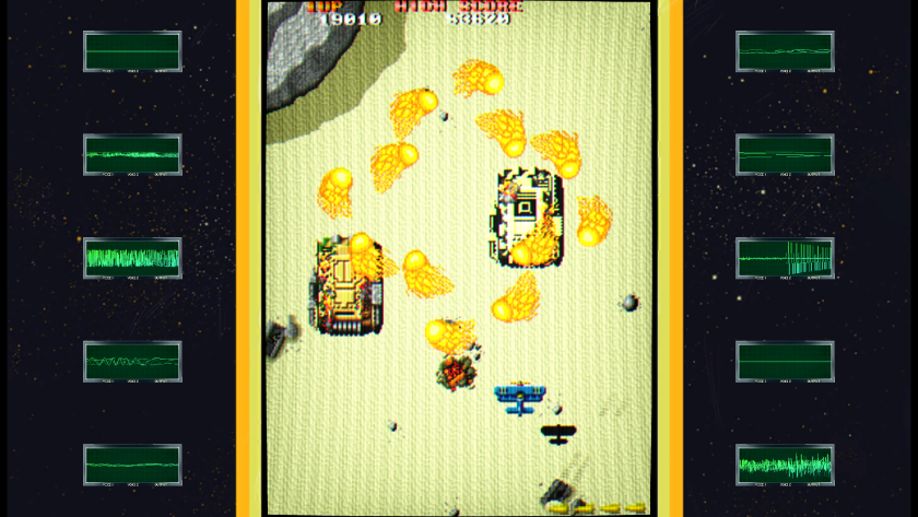 A biplane dropping a bomb on some tanks
