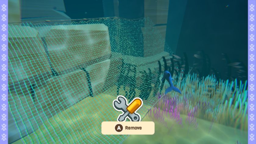 A trawler net spread around the underwater ruins of Turtle Bay, with the on-screen message of press A to remove.