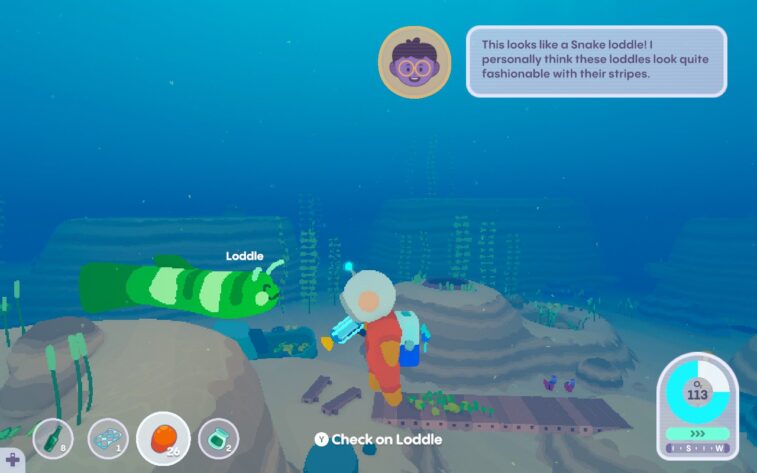 A diver protagonist faces off with a green striped creature called a "loddle"-- it's got a face like an axolotl, and a body like a worm. Assorted icons and prompts for gameplay surround the edges of the screen.