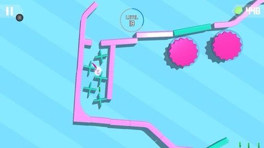 In-game screenshot of 'Tricky Taps', featuring a challenging level where a white ball must navigate through a pink maze with rotating sections and avoid two large pink spiky obstacles. The ball appears trapped in a section of the maze that is enclosed by green gates, suggesting a puzzle element to release it. The level is indicated as 'LEVEL 18' and there are 448 gems collected, as shown in the top right corner. The game's visual style is bright and colorful with a light blue striped background, enhancing the vibrant pink and green maze structure. Published on: LadiesGamers.