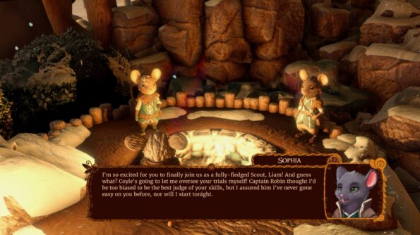 The Lost Legends of Redwall: The Scout Anthology In-game dialogue scene featuring two anthropomorphic mouse characters dressed in scout uniforms within a warmly lit cave environment. The left character stands attentively, while the right character appears in a dialogue portrait, named Sophia, with a text box below. Sophia's portrait shows a gray mouse with green eyes and a friendly expression. The text reads, 'I'm so excited for you to finally join us as a fully-fledged Scout, Liam! And guess what? Coyle's going to let me oversee your trials myself! Captain Robin thought I'd be too biased to be the best judge of your skills, but I assured him I've never gone easy on you before, nor will I start tonight.' The cave's walls are brown and rugged, with glowing particles and wooden fences enhancing the mystical atmosphere.