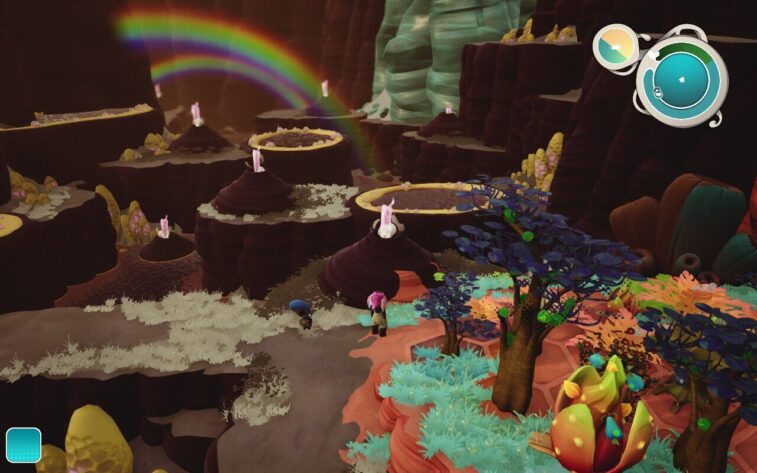 This scene from Distant Bloom shows the character traversing a surreal landscape with bee-like creatures atop beehive-shaped platforms under a vibrant rainbow. Various alien flora in bright colors sprawl across the terrain with a prominent blue and orange plant in the foreground. The player's inventory shows a shovel, indicating gardening gameplay. Published on: LadiesGamers.