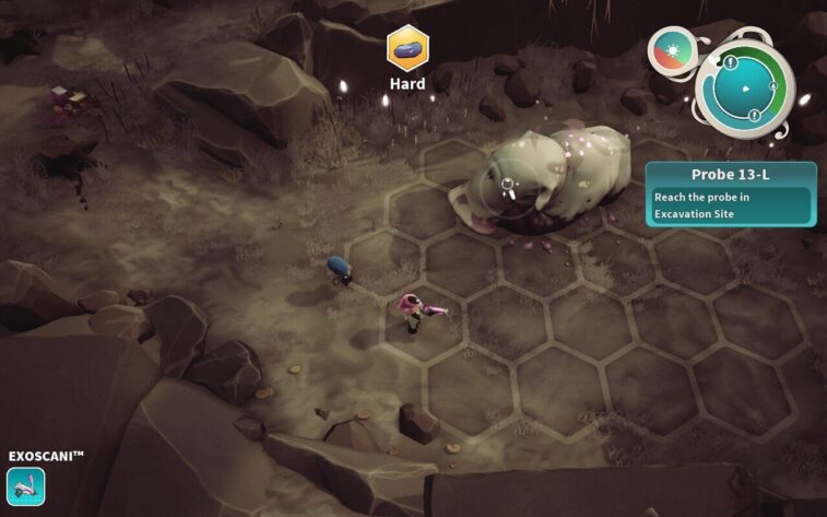 In Distant Bloom, the assistant in a pink suit examines a large, docile, grub-like creature in a rocky, barren landscape with a "Hard" terrain indicator above. The mission "Probe 13-L" prompts the player to reach the probe in an Excavation Site, suggesting an exploration and discovery gameplay element. Published on: LadiesGamers.