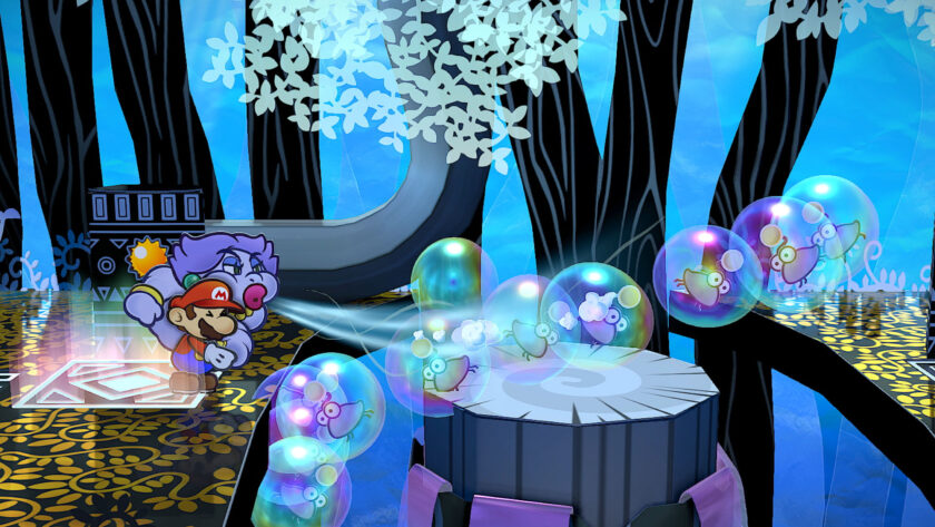 A dynamic scene from Paper Mario: The Thousand-Year Door showing Mario and a purple companion using a wind attack in a colorful, whimsical forest setting. They are depicted in a paper cut-out art style, standing on a patterned platform with a backdrop of blue-tinted trees and decorative white leaves. In the foreground, transparent bubbles containing tiny, stylized creatures float around, adding to the magical atmosphere of the game. Published on: LadiesGamers