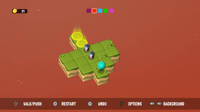 A Sokobalien puzzle stage set against an orange background. The player has 21 coins, as seen in the top left corner. The level consists of a green, grassy platform floating in space with cows and a blue alien player character. Yellow glowing buttons on the platform project light beams upward. Icons at the bottom show game controls for walking, pushing, restarting, undoing, and accessing options. The simple orange backdrop suggests a change in the environment or time of day within the game. Published on: LadiesGamers.