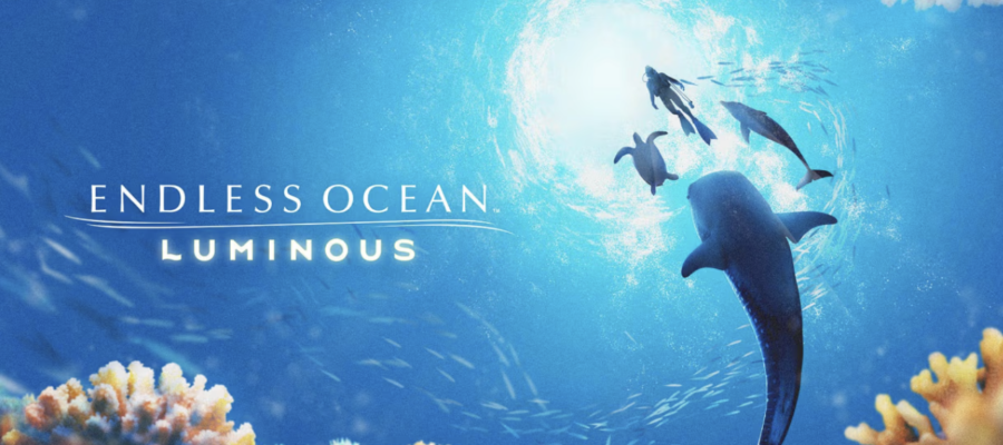A captivating promotional image for Endless Ocean: Luminous, showing a serene underwater scene filled with vibrant marine life. In the foreground, a large, graceful dolphin swims upwards towards the light filtering through the water's surface, surrounded by smaller fish and other dolphins. The sea is depicted in brilliant shades of blue, illuminated by sunlight, with colorful coral formations at the bottom. The visual emphasizes the tranquil and exploratory nature of the game, inviting players to dive into a beautifully rendered oceanic world. Published on: LadiesGamers.