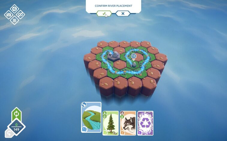 A small cluster of hexagonal tiles surrounded by water, featuring a winding river and sparse vegetation. The screen prompts to confirm river placement, with action cards visible at the bottom. Published on: LadiesGamers.