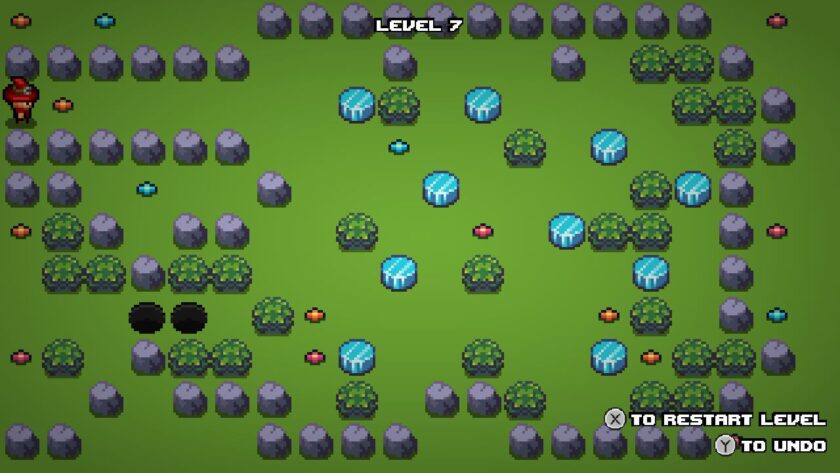 Level seven with the mage standing near bushes and blue stones, with two holes blocking the path. Published on: LadiesGamers