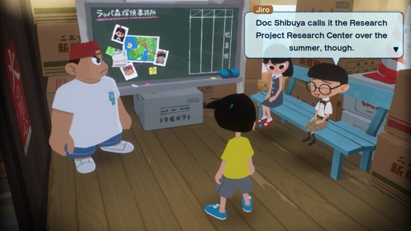 Inside a small room, a group of children, led by Jiro, discuss the "Research Project Research Center" over the summer, as indicated by the chalkboard behind them. Published on: LadiesGamers.