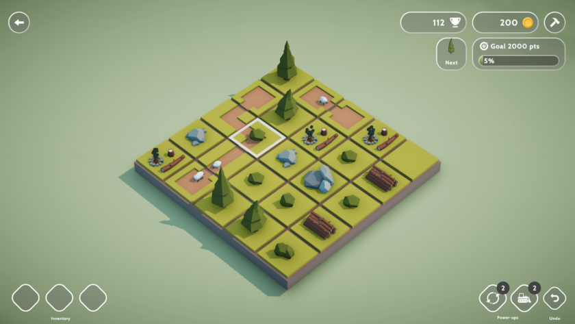 An image from Teeny Tiny Town showing one of the layouts. A board with a green base and various trees and rocks placed on tiles on the board