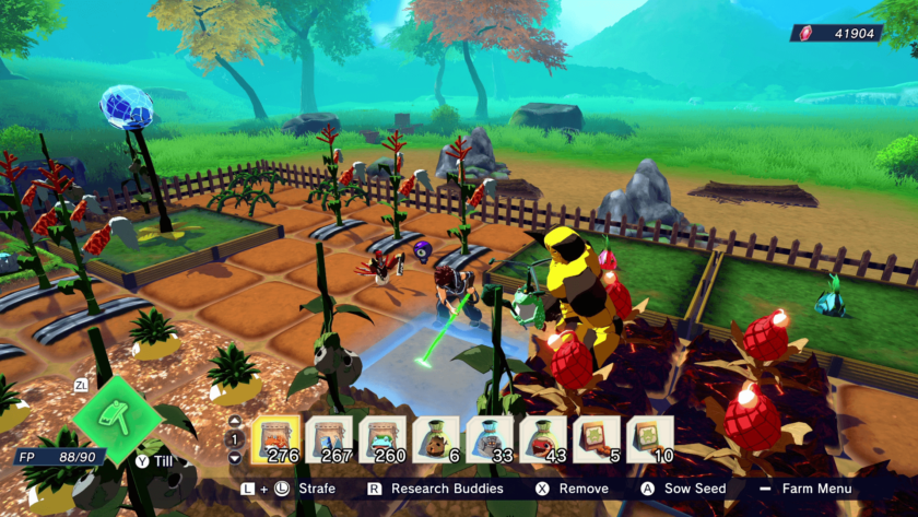 A vibrant farming scene in Farmagia where a character tends to crops with the help of a companion in a colorful, lush environment. The player is equipped with a tilling tool, and various plant species are growing in neat rows, surrounded by a wooden fence and natural landscape. A research robot is nearby, hinting at technological tools used in the farming process. The interface at the bottom shows farm supplies and options for managing the garden. Published on: LadiesGamers