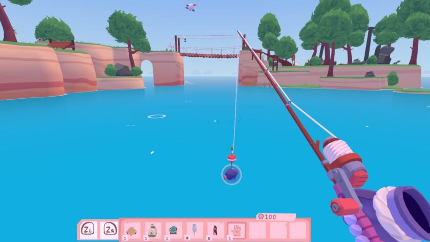Standing at the ocean side, with my fishing rod in hand. A fish, in a bubble, is being reeled in. Published on: LadiesGamers