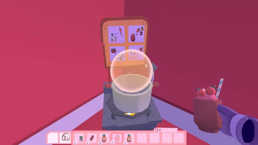 A cooking pot, with 4 recipe cards on a stand behind it. There is a fruit smoothie with a straw in my right hand. Published on: LadiesGamers