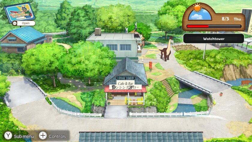An overhead view of a peaceful town center in Shin chan: Me and the Professor on Summer Vacation, featuring a cozy café with a sign that reads "Cafe & Bar." Surrounding greenery, a small river, and pathways create a charming atmosphere, while a dinosaur statue adds a whimsical touch to the village scene. Shin-chan is visible walking near a bridge in the lower right corner. Published on: LadiesGamers.