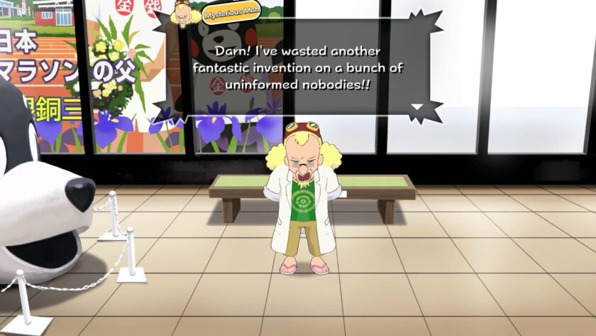 A quirky character known as the "Mysterious Man" stands frustrated inside a room in Shin chan: Me and the Professor on Summer Vacation, his hands clenched in disappointment. He’s wearing a lab coat, sandals, and a T-shirt with a spiral design, while a speech bubble above him reads, “Darn! I’ve wasted another fantastic invention on a bunch of uninformed nobodies!!” A large mascot head is displayed on the left, adding to the humorous setting. Published on: LadiesGamers.