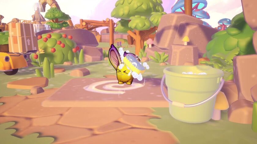 Yellow critter being washed with a soapy sponge, there is a bucket of water next to it. Published on: LadiesGamers