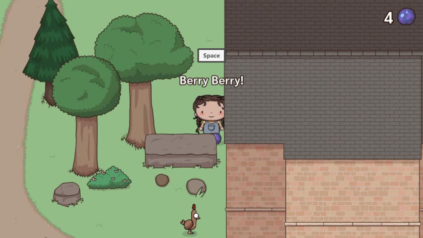 A little girl stands in front of a giant blueberry called a Berry Berry in Berry Berry Festival.