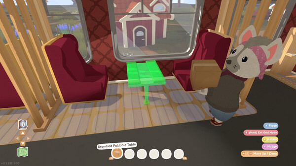 A screenshot from Locomoto shows a cozy train interior with wooden paneling and red cushioned seats. A small, green-highlighted foldable table is being placed between two seats. A mouse-like character wearing a pink bandana and a brown vest holds a cardboard box while standing on the wooden floor. Through the window, a charming town building with a red roof is visible. The user interface displays placement options and an inventory bar. Published on: LadiesGamers.