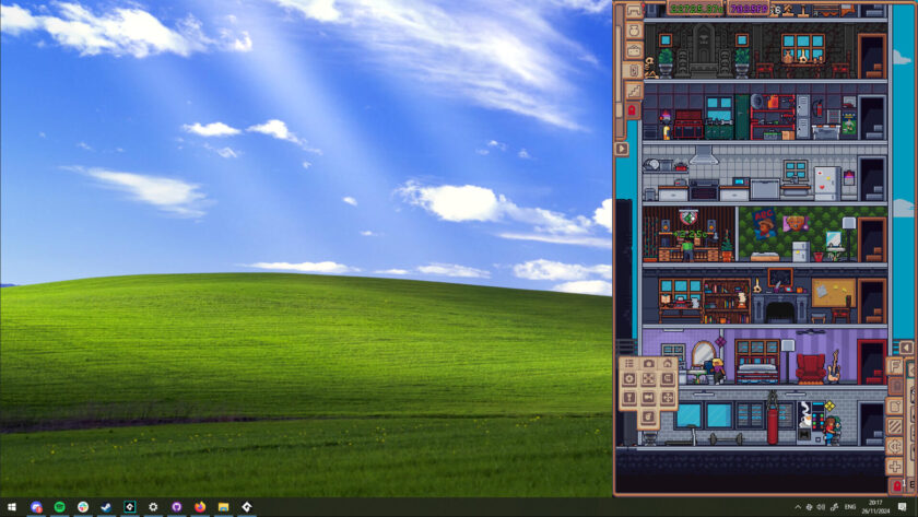 a tower of tiny people houses on the side of a windows desktop