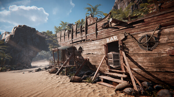 A weathered wooden ship repurposed into a beachside bar rests on golden sand in Amerzone: The Explorer’s Legacy. The structure retains its nautical charm, complete with rigging, barrels, and a rope-wrapped lifebuoy. Palm trees and jagged cliffs surround the scene under a bright, sunny sky, creating a tropical yet mysterious atmosphere. The word “BAR” is painted above the doorway, inviting explorers in for a break. Published on: LadiesGamers.