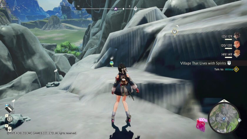 Yumia is walking across rocky terrain, heading toward a glowing collection point. The UI shows quest objectives, party HP, and a mini-map with navigation markers. The landscape features cliffs and grassy plains. Published on: LadiesGamers.