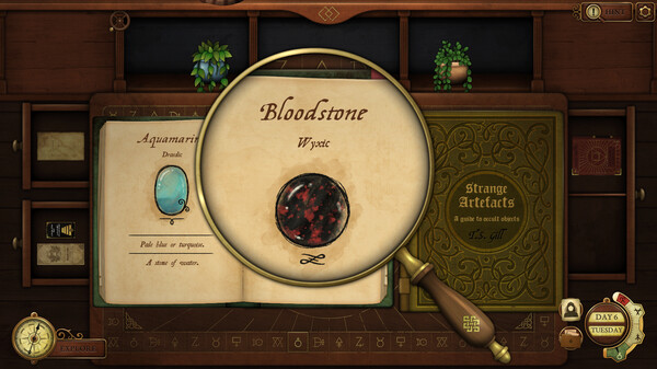 A richly detailed desk scene features an open book titled "Strange Artefacts" alongside a magnifying glass highlighting a gemstone labeled "Bloodstone." The magnifier enlarges the dark, red-speckled stone, giving the interface a tactile, investigative feel. Another page shows a blue aquamarine gem with descriptive text. Ornamental plants, wooden drawers, and mystical symbols enhance the antique, alchemical atmosphere. Published on: LadiesGamers.
