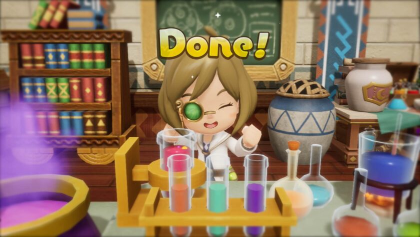 A cheerful character in Fantasy Life i in a white lab coat stands behind a colorful chemistry set in a cozy, book-filled lab. They wear a green monocle and smile triumphantly under the bold yellow word "Done!" after successfully crafting something. Published on: LadiesGamers