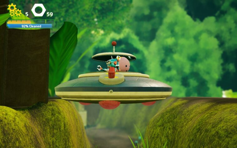 In Misc. A Tiny Tale a wind-up robot pilot stands in the open dome of a small flying saucer-like craft, hovering over a mossy terrain surrounded by towering green plants. Published on: LadiesGamers