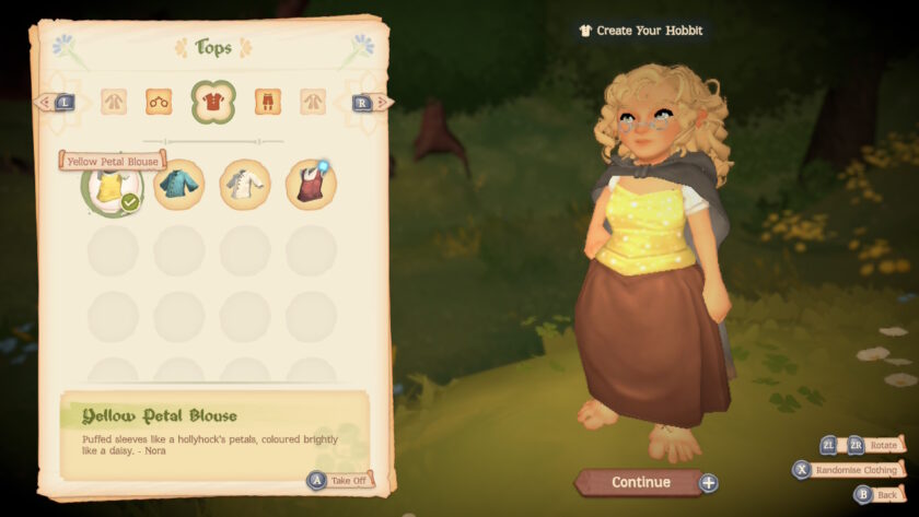 A character creation screen from Tales of the Shire showcases a customisable hobbit wearing a Yellow Petal Blouse with puffed sleeves described as “like a hollyhock's petals, coloured brightly like a daisy.” The character pairs it with a dark shawl and brown skirt, standing in a warmly lit room filled with clothing options. Buttons to rotate, randomise, and continue the customisation process are visible, evoking a gentle, homey atmosphere at the heart of the game’s charm. Published on: LadiesGamers.