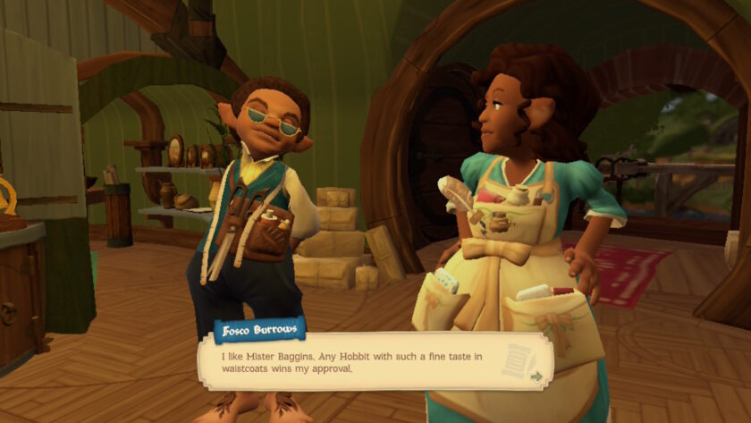 Inside a warm, hobbit-inspired room, two characters stand among shelves brimming with pottery and keepsakes. One wears a blue waistcoat over a crisp white shirt, with a pouch and coil of rope at their side. The other dons a light blue dress and a white apron, pockets stuffed with trinkets. A dialogue box at the bottom reads, “I like Mister Baggins. Any Hobbit with such a fine taste in waistcoats wins my approval.”, credited to Fosco Burrows. A moment of admiration and charm in the whimsical world of Tales of the Shire. Published on: LadiesGamers.