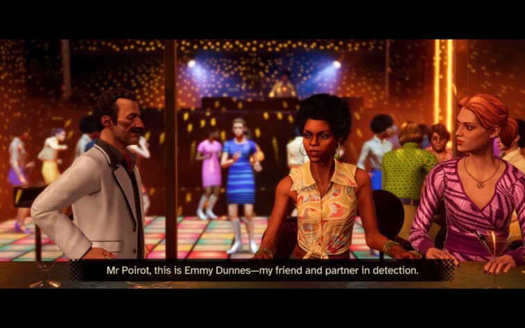 a man and two women talking in a club