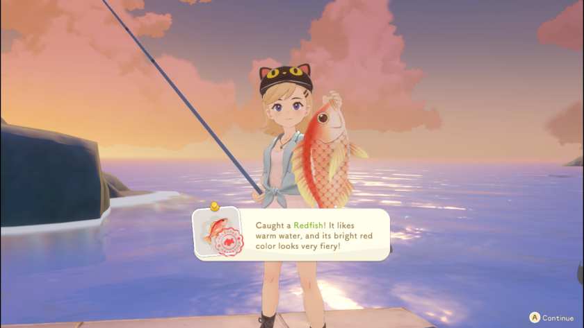 A girl holding a fish she caught in Starsand Island