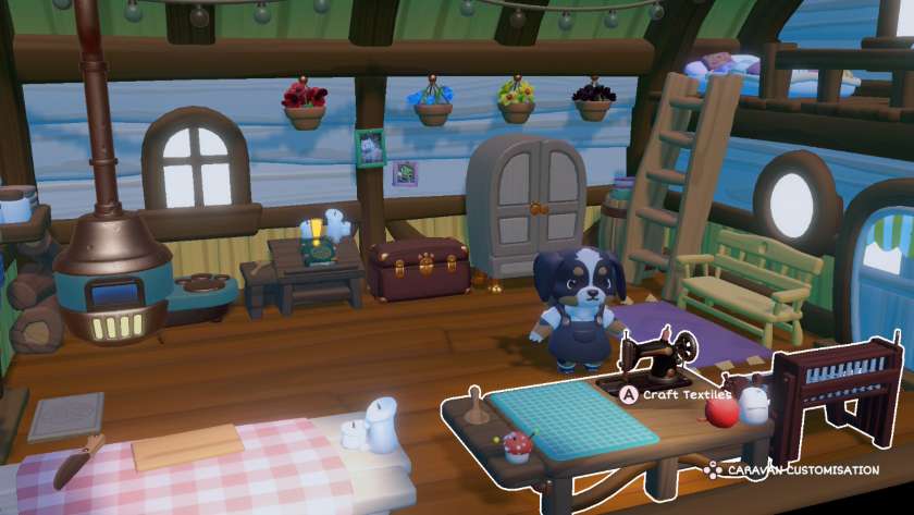 Inside the cosy caravan. There is an oven, stove, cooking bench, recipe book, chest, wardrobe and crafting station, as well as a bench and elevated bed. Published on LadiesGamers