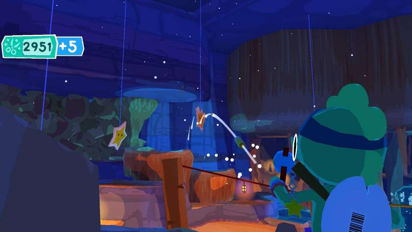 The gator aims bouncy balls at some cardboard demons in Lil Gator Game: In the Dark DLC.