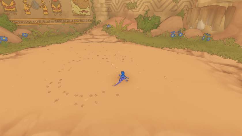 The gecko in the middle of the sand, surrounded by his pawprints in Gecko Gods.